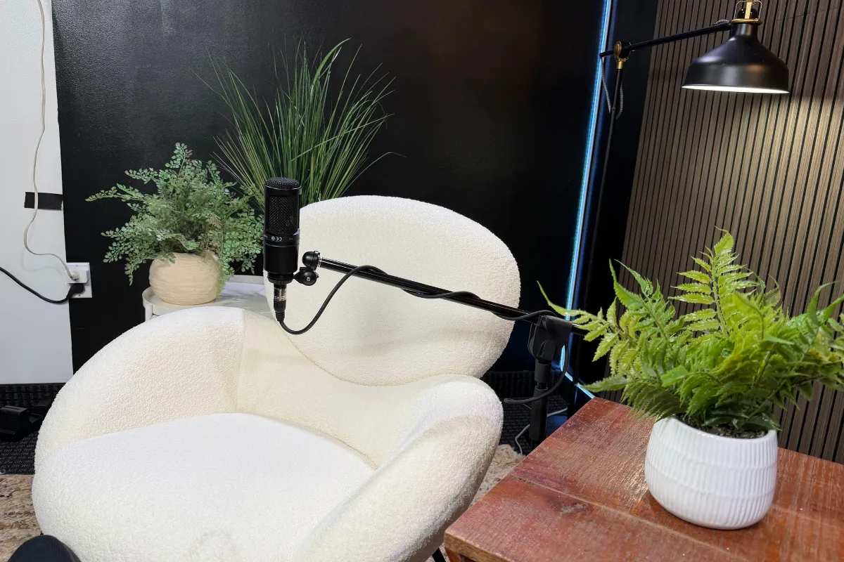 Podcast microphone setup with modern studio seating