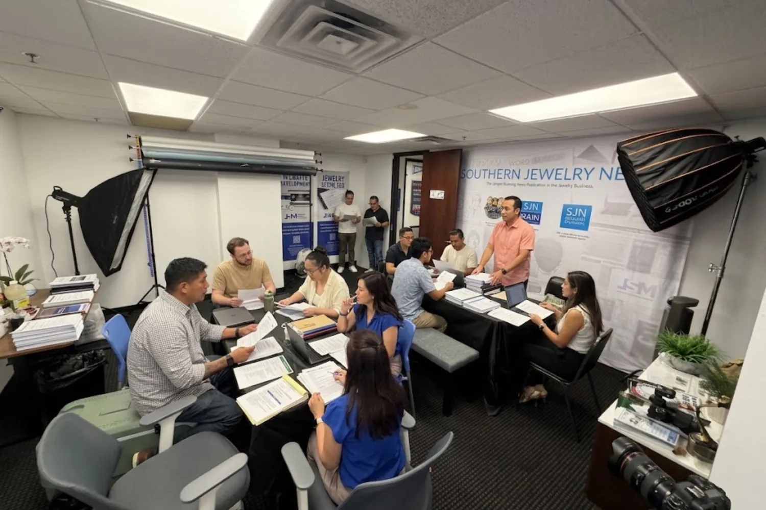 Group of people meeting around a table in an office