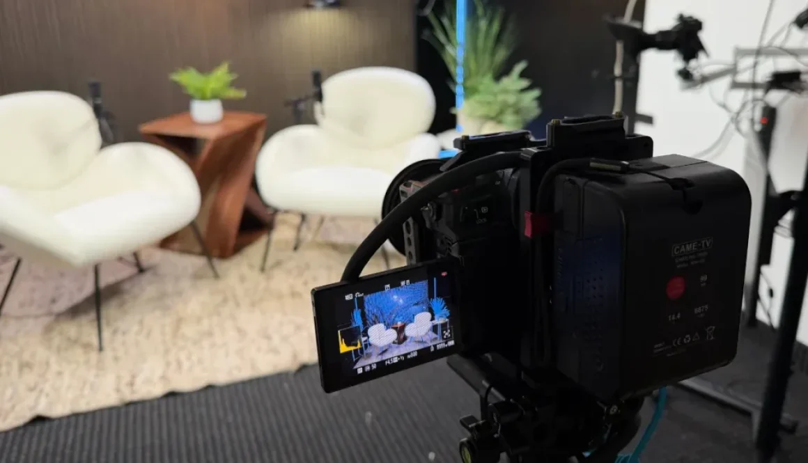 Podcast video camera filming a modern studio set