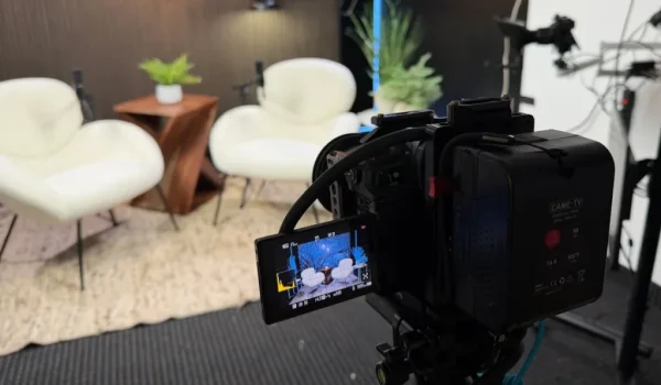Podcast video camera filming a modern studio set