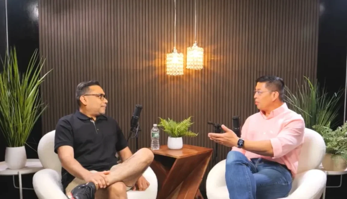 Two men discussing topics during a podcast interview
