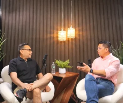 Two men discussing topics during a podcast interview